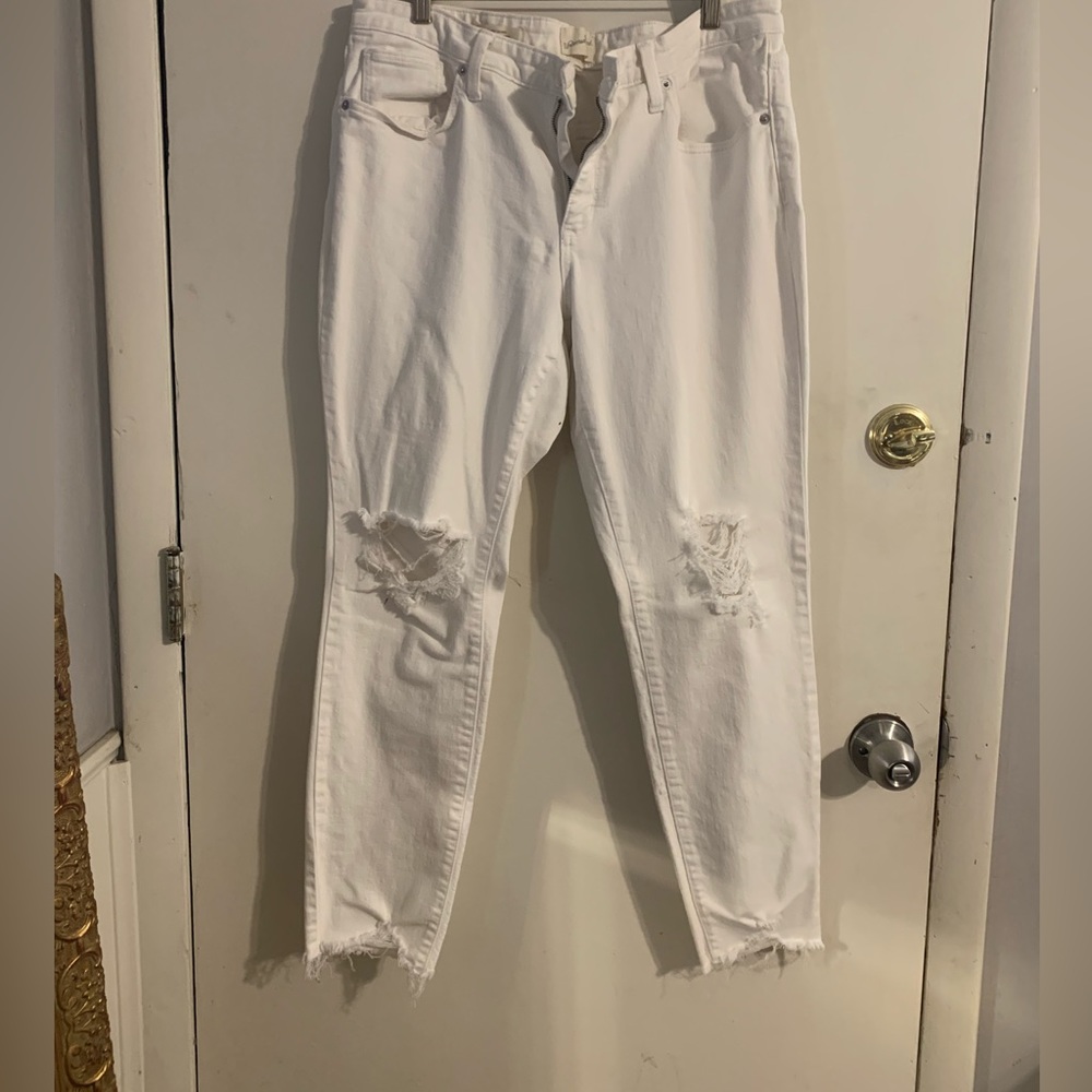 Distressed white jeans